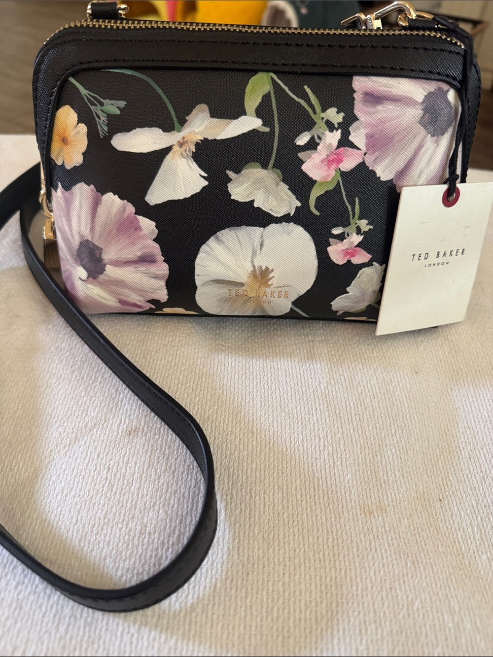 NWT, Ted Baker crossbody in a floral/black 
Print .